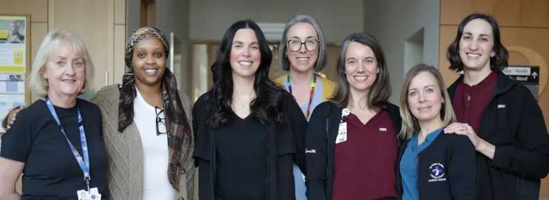 Group of internationally educated nurses from The Ottawa Hospital standing together in a hospital hallway