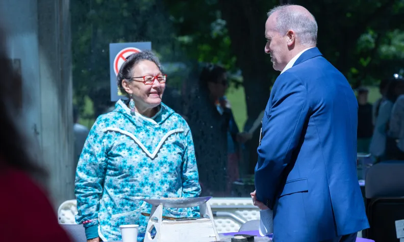 Cameron Love (right), President and CEO of The Ottawa Hospital, chats with Inuk Elder Reepa Evic-Carleton (left).