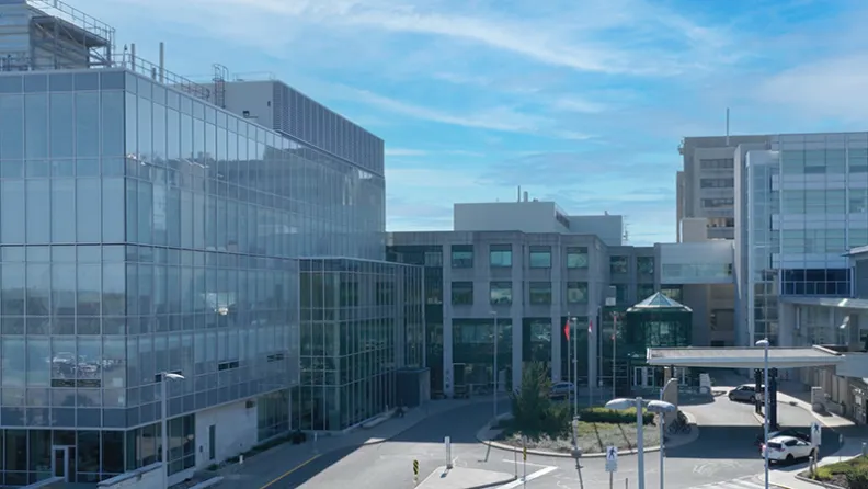 Exterior view of The Ottawa Hospital Cancer Building in Ottawa, featuring modern glass architecture and main entrance.
